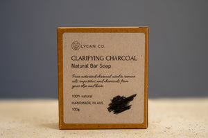 Ingredients label on LycanCo Clarifying Charcoal Bar Soap showing coconut oil, olive oil, and activated charcoal on sustainable paper.