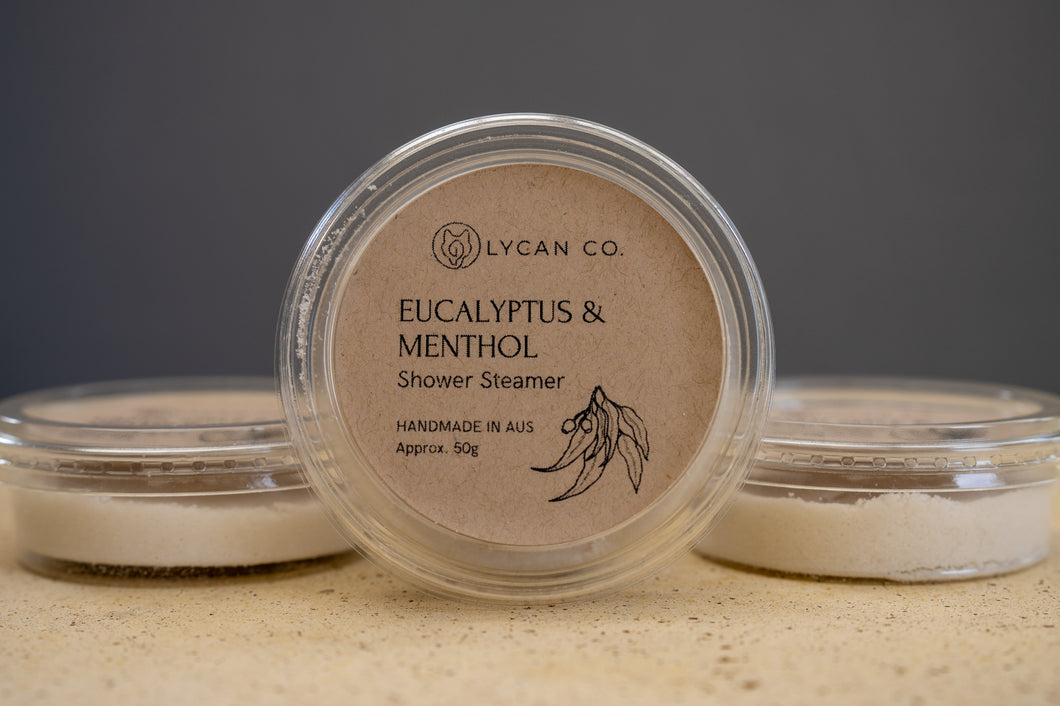 LycanCo Eucalyptus & Menthol Shower Steamer in clear packaging, designed to provide a refreshing and invigorating shower experience.
