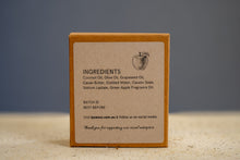 Load image into Gallery viewer, Back label of LycanCo Glorious Green Apple Bar Soap highlighting its fresh green apple essential oils.