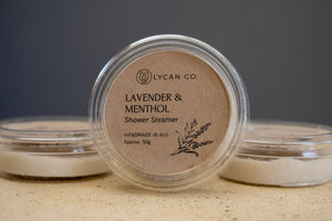 LycanCo Lavender & Menthol Shower Steamer visible in translucent container, offering a soothing and calming steam shower.